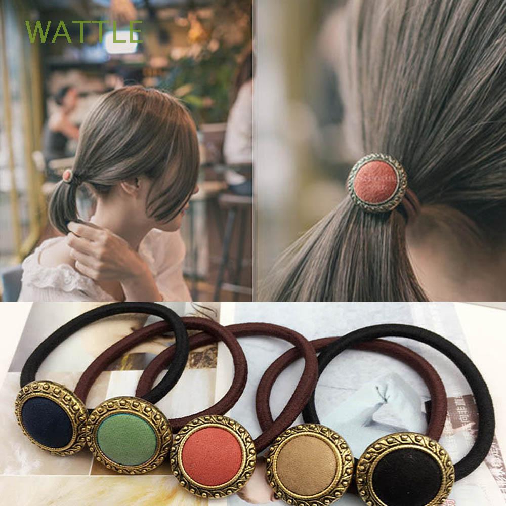 Cài tóc đính nút thời trang nữ tính