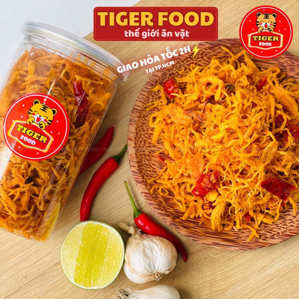 Khô Gà Bơ Tỏi Xé Cay TIGER FOOD Khô Gà Bơ Tỏi Đậm Vị Siêu Ngon Lon 300g - Đồ Ăn Vặt Sài Gòn