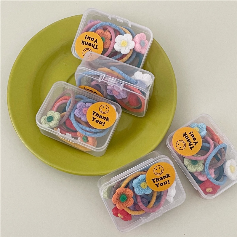 Hộp 7 chiếc cột tóc hoa nhựa nhiều màu cho bé