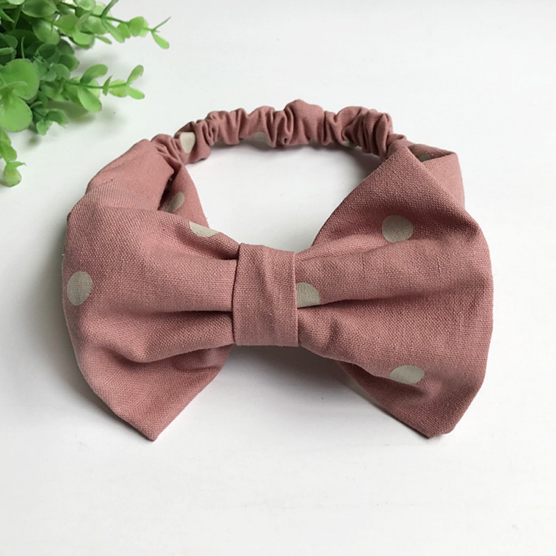 Băng đô đính nơ chấm bi công chúa cho bé