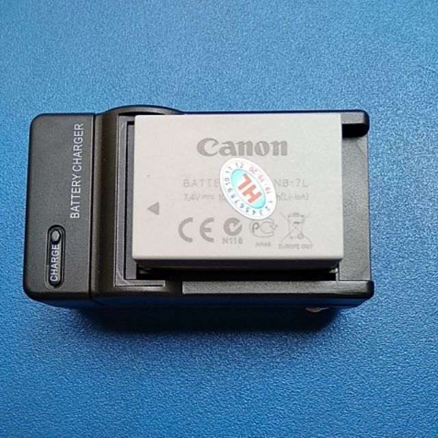 Sạc cho pin canon NB-7L loại có chân gạt cắm điện