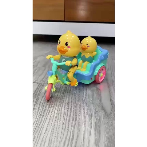Đồ chơi vịt đạp xe có đàn nhạc vui nhộn bánh xe phát sáng - vịt chạy xe nhựa an toàn cho bé
