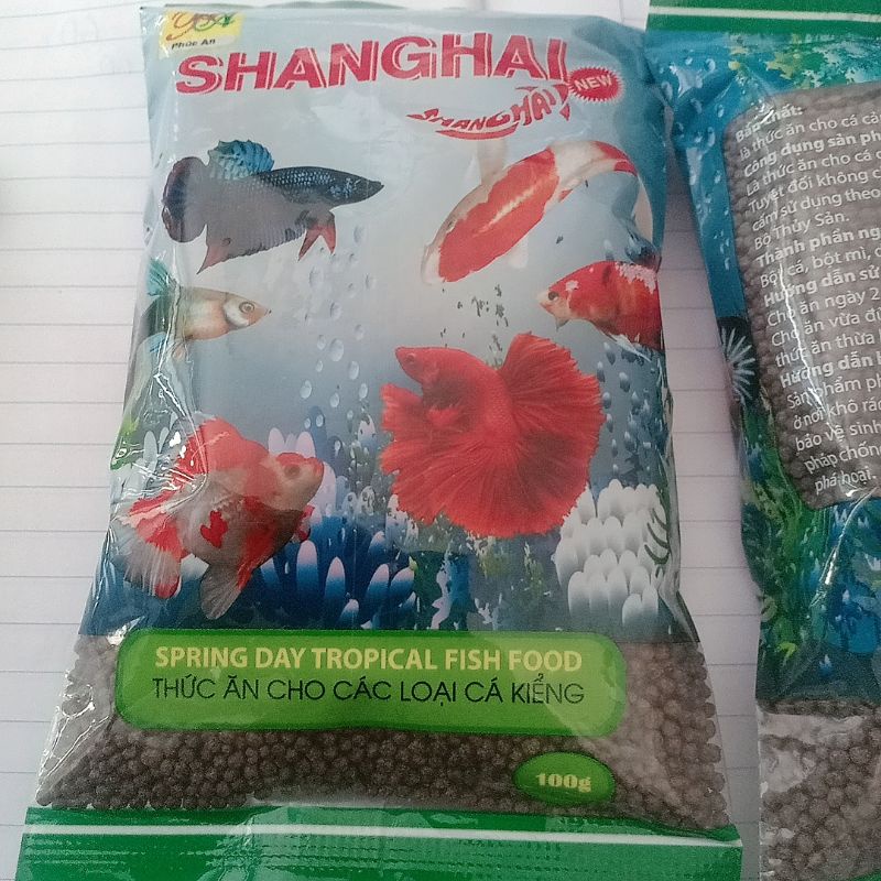 Cám Cá Kiểng ShangHai 100gr - Thức Ăn Cho Các Loại Cá Kiểng Giúp Cá Nhanh Lên Màu -NaHi Shop