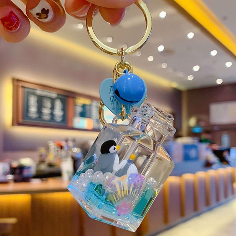 Móc khóa xe máy chai nước chứa đựng cả đại dương ngộ nghĩnh và đáng yêu chuẩn Hot trend Tik Tok