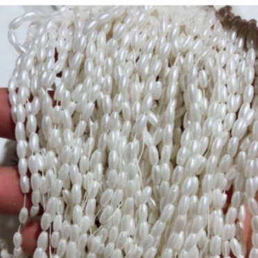 gói 5-10-25gam hạt nhựa hình hạt lúa màu kem 4x8mm