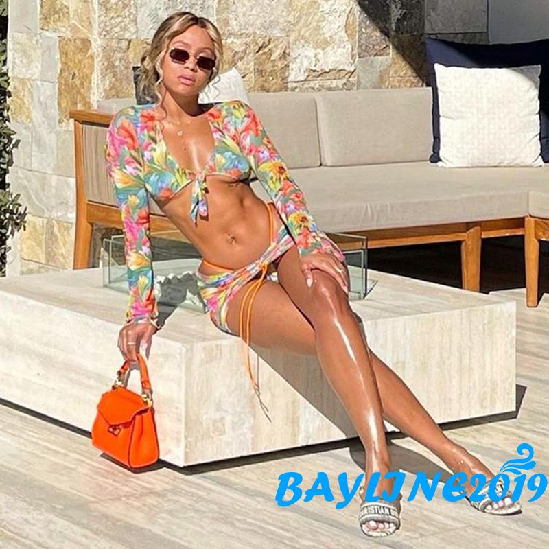 Bộ đồ 2 món áo croptop tay dài cổ chữ V buộc dây in họa tiết hoa + chân váy dây rút thời trang đi biển cho nữ | BigBuy360 - bigbuy360.vn