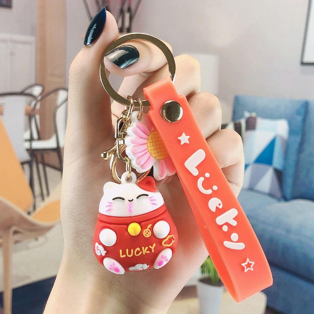 Móc Khóa Hình Chú Mèo May Mắn Và Hoa Cúc Đỏ Dễ Thương