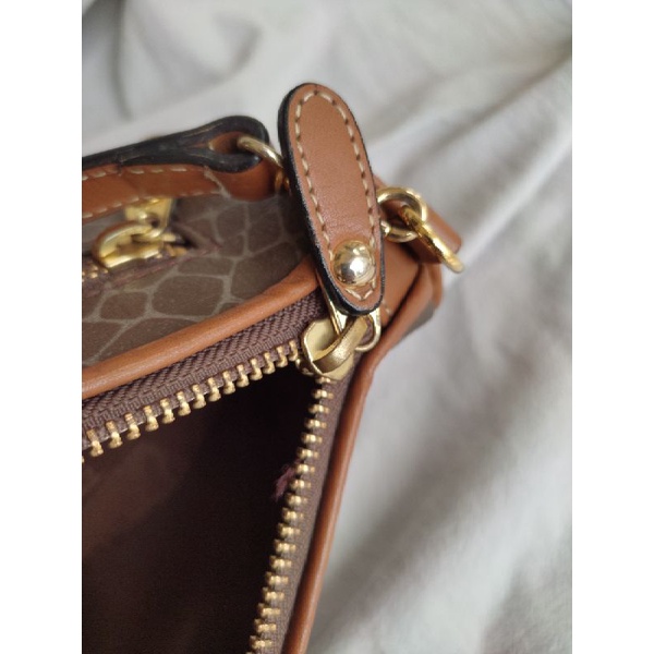 Túi kẹp nách Nina Ricci