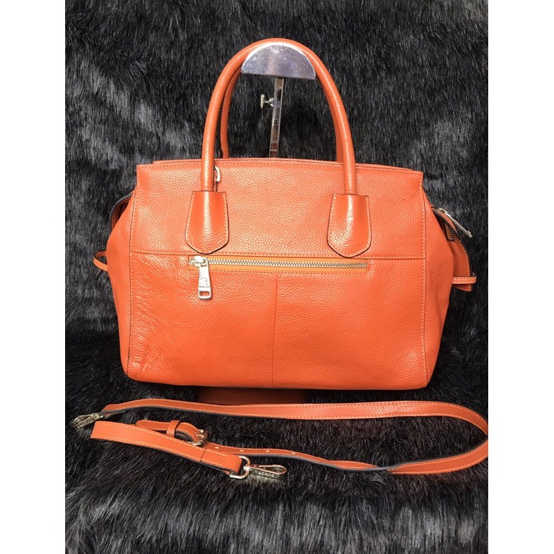 👜  Túi cầm tay, đeo chéo da thật màu cam hiệu Tucano