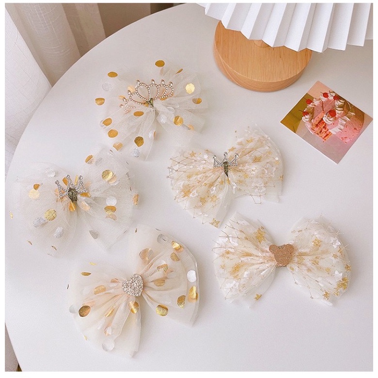 Kẹp tóc nơ tone vàng xinh xắn cho bé