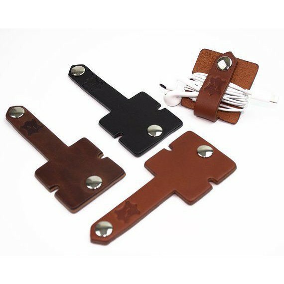 Miếng kẹp tai nghe điện thoại da bò màu ngẫu nhiên