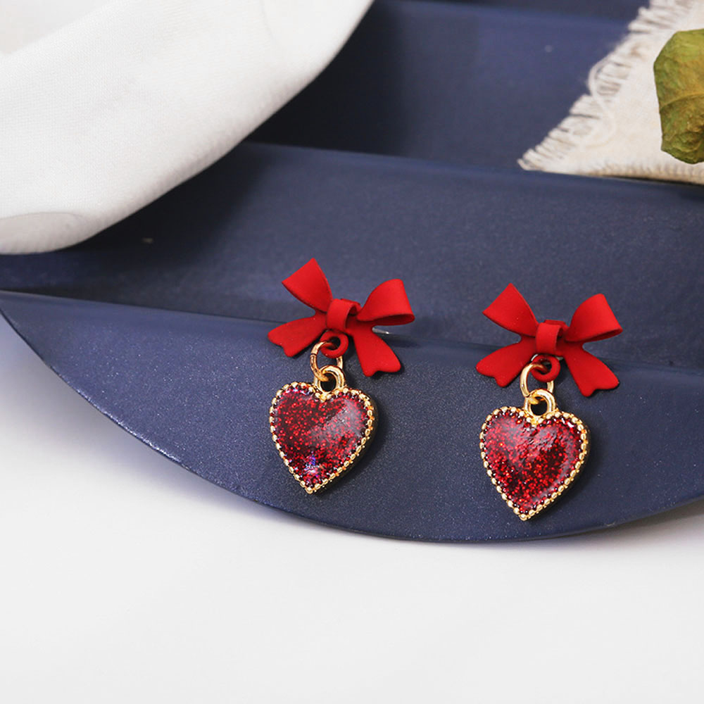 Cặp bông tai hình nơ gắn trái tim màu đỏ đáng yêu cho nữ