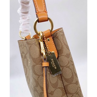 Túi Coach da thật pha canvas dáng ống màu mới