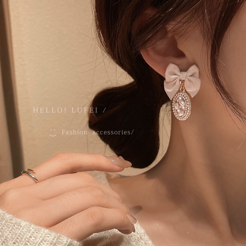Khuyên tai nơ trắng sữa thời trang thu đông cho nữ