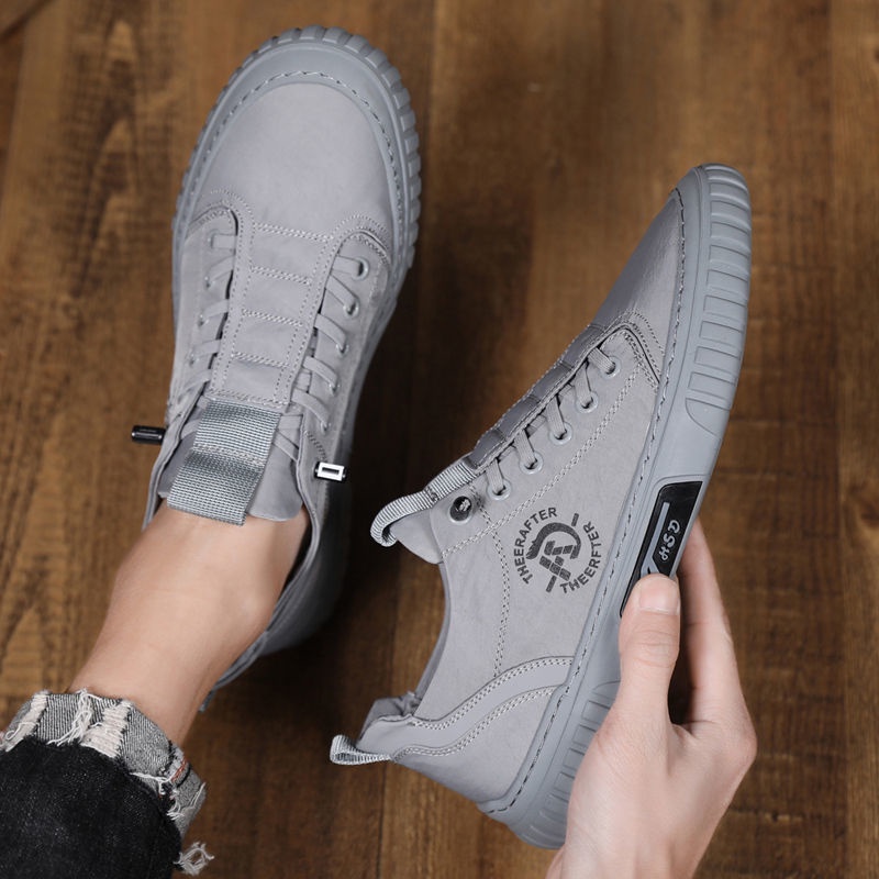 LACOSTE Giày Thể Thao Trắng Phối Vải Canvas Thoáng Khí Phong Cách Mới Cho Nam