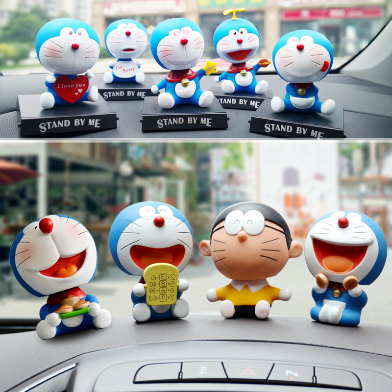 Mô Hình Nhân Vật Nobita Nobi Đầu Lắc Bằng PVC 12 Phong Cách 12cm Có Giá Đỡ Điện Thoại Trang Trí Xe Hơi