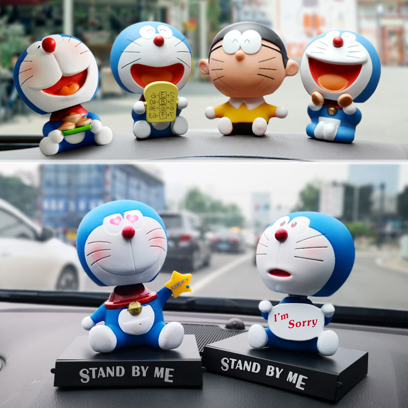 Mô Hình Nhân Vật Nobita Nobi Đầu Lắc Bằng PVC 12 Phong Cách 12cm Có Giá Đỡ Điện Thoại Trang Trí Xe Hơi