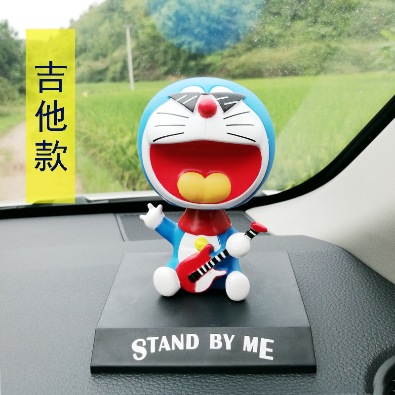 Mô Hình Nhân Vật Nobita Nobi Đầu Lắc Bằng PVC 12 Phong Cách 12cm Có Giá Đỡ Điện Thoại Trang Trí Xe Hơi