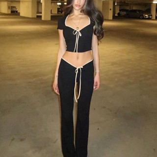 Bộ đồ KLALIEN gồm áo croptop ngắn tay đính nơ và quần lưng thun ống loe thời trang cho nữ