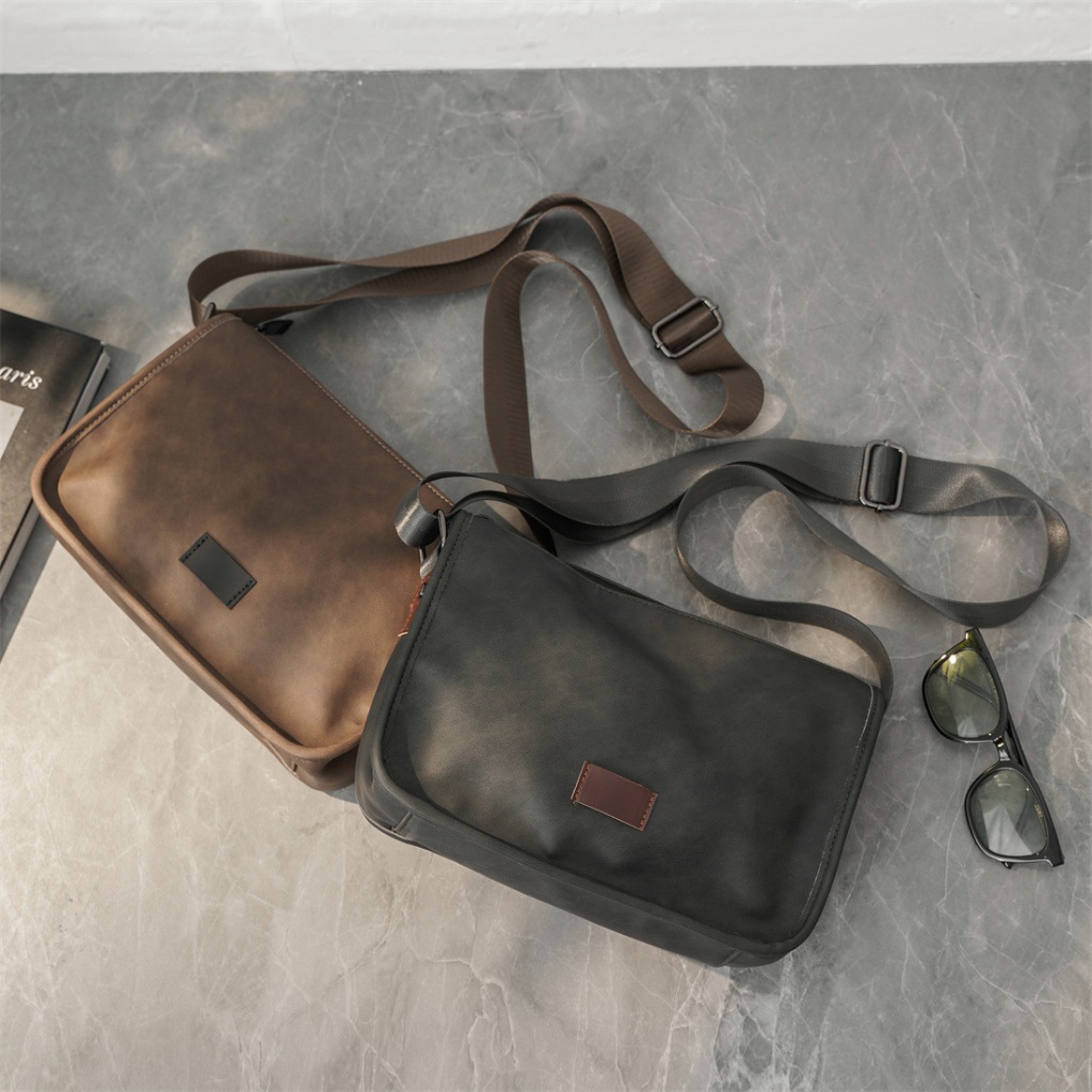 Arctic HUNTER túi xách nam xu hướng mới túi đeo vai đơn giản màu trơn Chất liệu PU mờ retro túi chéo giải trí ngoài trời phù hợp ba lô đi xe đạp