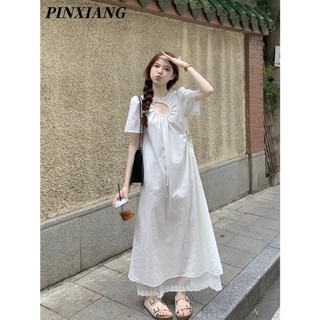 Pinxiang Váy ren nữ mới rỗng phong cách ngày lễ bên bờ biển dáng rộng Váy dài chữ A