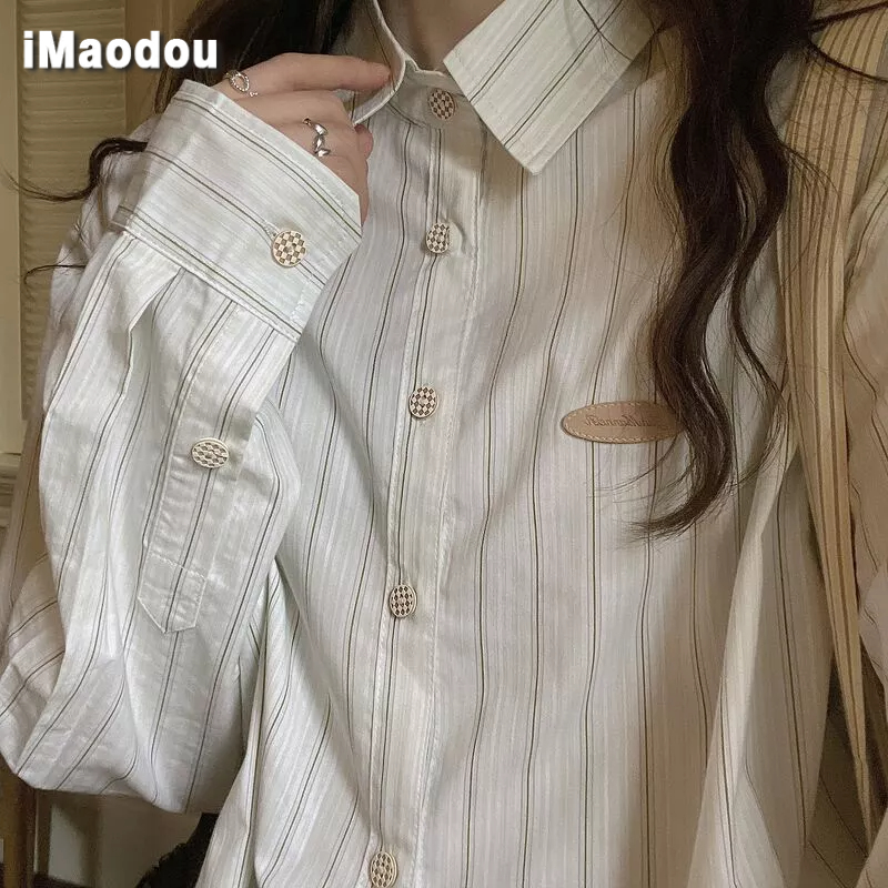 IMAODOU Kẻ caro nút lưới áo sơ mi sọc nữ thiết kế thích hợp lỏng lẻo cảm giác gió lười biếng 2021 các mẫu mùa xuân và mùa thu áo sơ mi cổ trụ polo