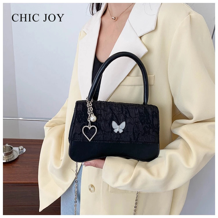 Túi xách CHIC JOY có dây xích trái tim nơ cao cấp dành cho bạn nữ