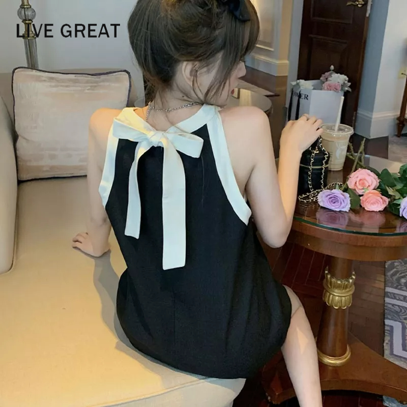 LIVE GREAT Xiaoxiangfeng Đầm Dáng Chữ a Không Tay Cổ Yếm Buộc Dây Sau Lưng Thời Trang Xuân Hè Thiết Kế niche Nhỏ