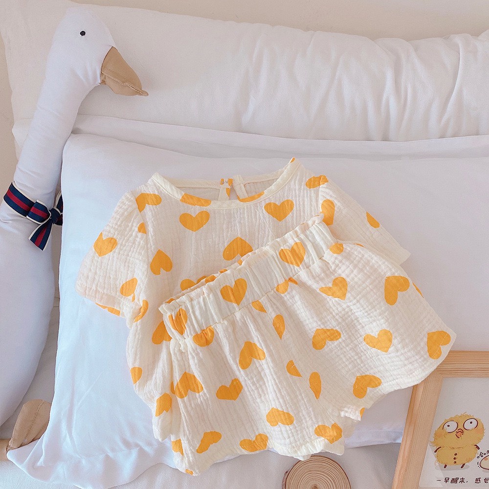 Bộ đồ bé gái mùa hè thoáng mát họa tiết trái tim, vải mềm thấm hút, hàng Quảng châu cao cấp