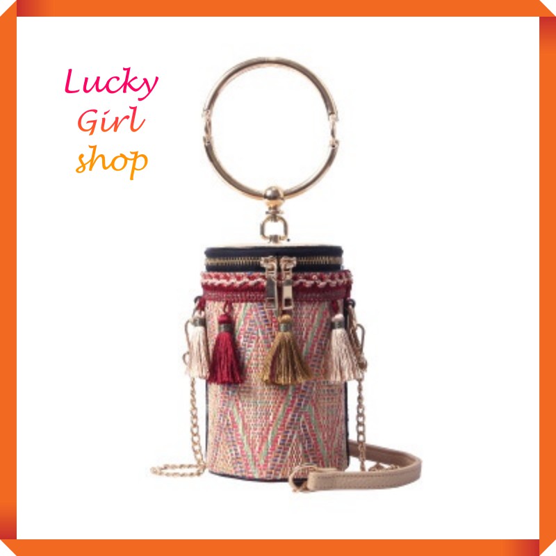 Túi cói tròn trụ gắn tua rua, quai xách kim loại kèm dây đeo dài - Lucky Girl shop