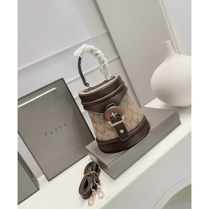 Túi cắp lồng hoạ tiết coach