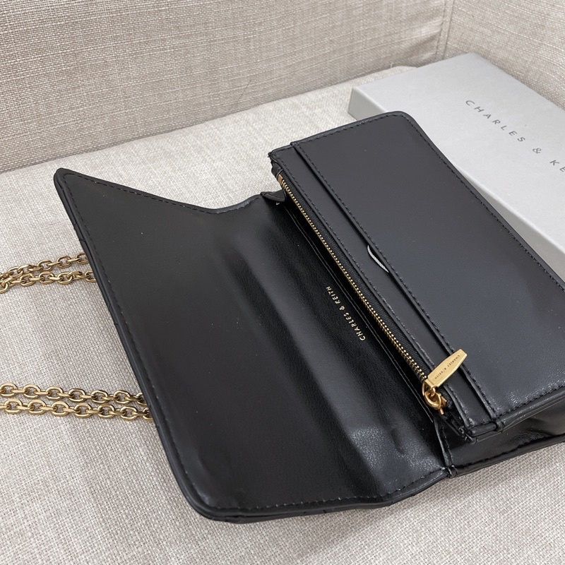 Túi dạng clutch trám ô da lì