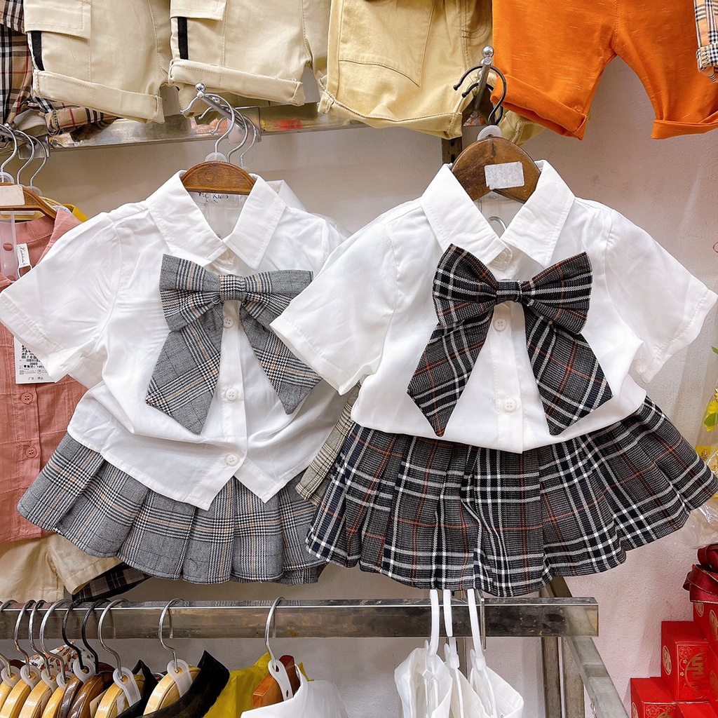 Set váy học sinh bé gái, áo sơ mi trắng đính nơ kèm chân váy kẻ xếp ly