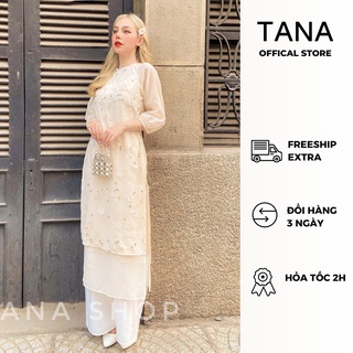 Áo dài cách tân TANA D0039 màu vàng nhạt họa tiết hoa lá gồm set áo dài và quần lụa mặc dịp Tết