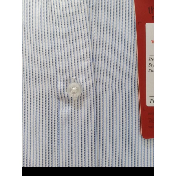 Áo sơ mi nữ Thái Hòa chất sợi tre pha cotton màu xanh nhạt.