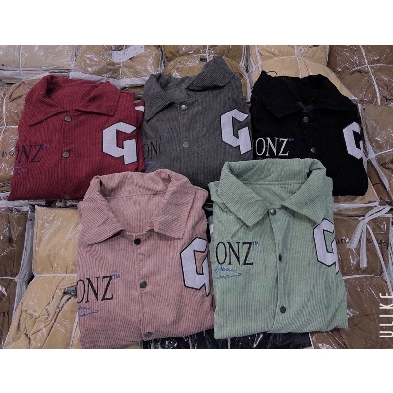 Áo khoác nhung tăm phối tay da lạ mắt in lưng