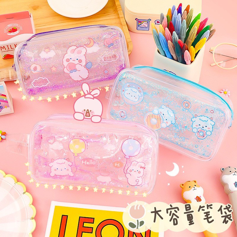 Hộp Bút Trong Suốt Hoạ Tiết Hạt Cát, Kim Tuyến Lấp Lánh Chuyển Động 19.5 x 9.5cm - Giao Ngẫu Nhiên