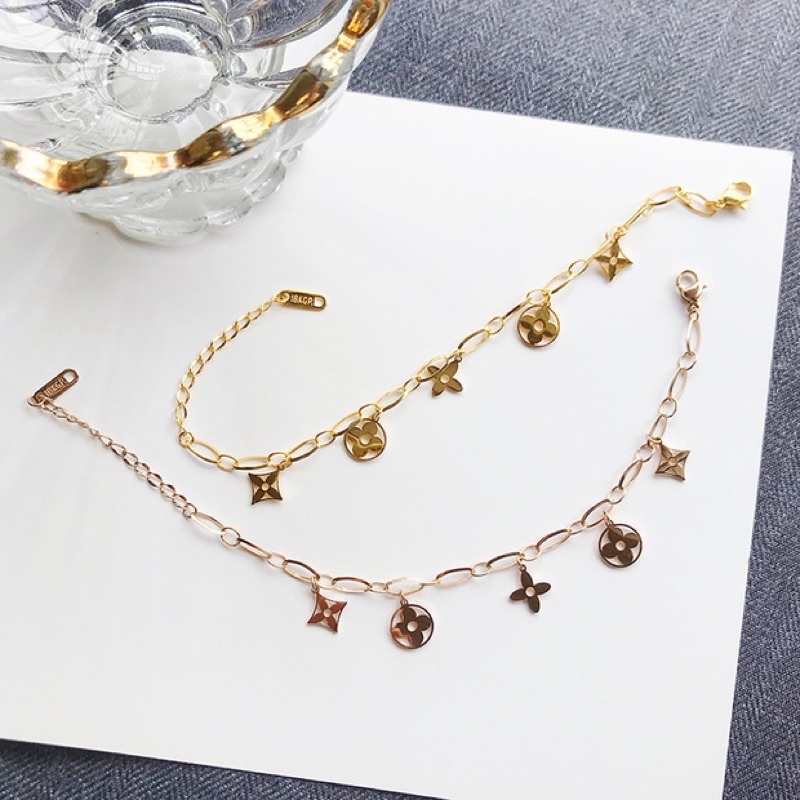 Lắc tay/Vòng tay titan hoa lv rỗng