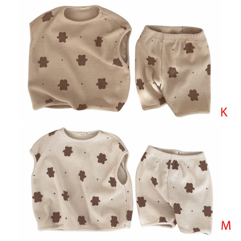 Set đồ 2 món gồm áo sát nách in hoạ tiết hoạt hình và quần short dành cho bé