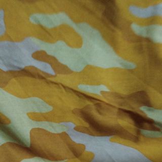 Cotton rằn ri vàng phối vàng đất chất thun 2 chiều
