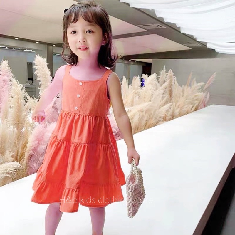 Váy vàng cam xoè tầng cho bé gái