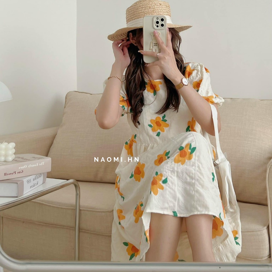 Váy babydoll dáng dài hoa vàng 2 lớp chất xốp bồng bềnh có dây buộc eo. Đầm dáng dài tay bồng babydoll hoa vàng