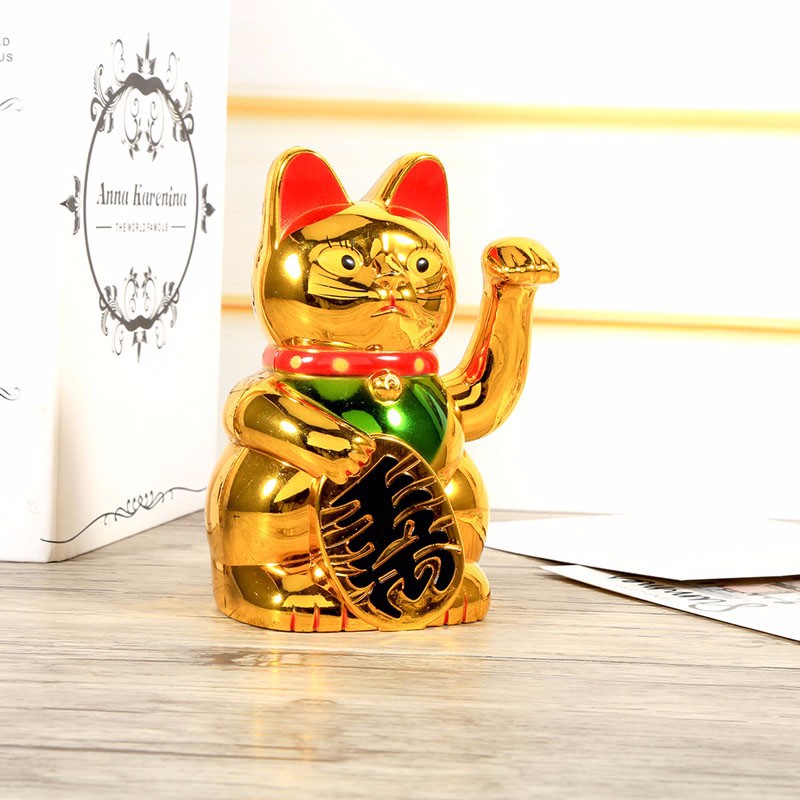 Mèo vàng thần tài vẫy tay phong thủy