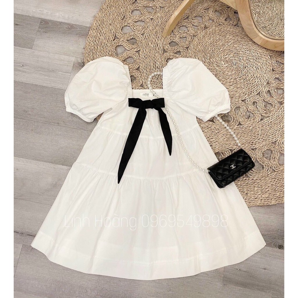 Đầm babydoll trắng cổ vuông tay phồng kèm nơ ngực