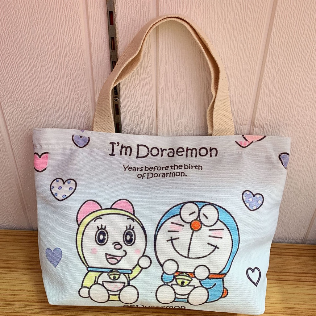 Túi xách đeo vai bằng vải canvas in họa tiết Doraemon đáng yêu cho nữ