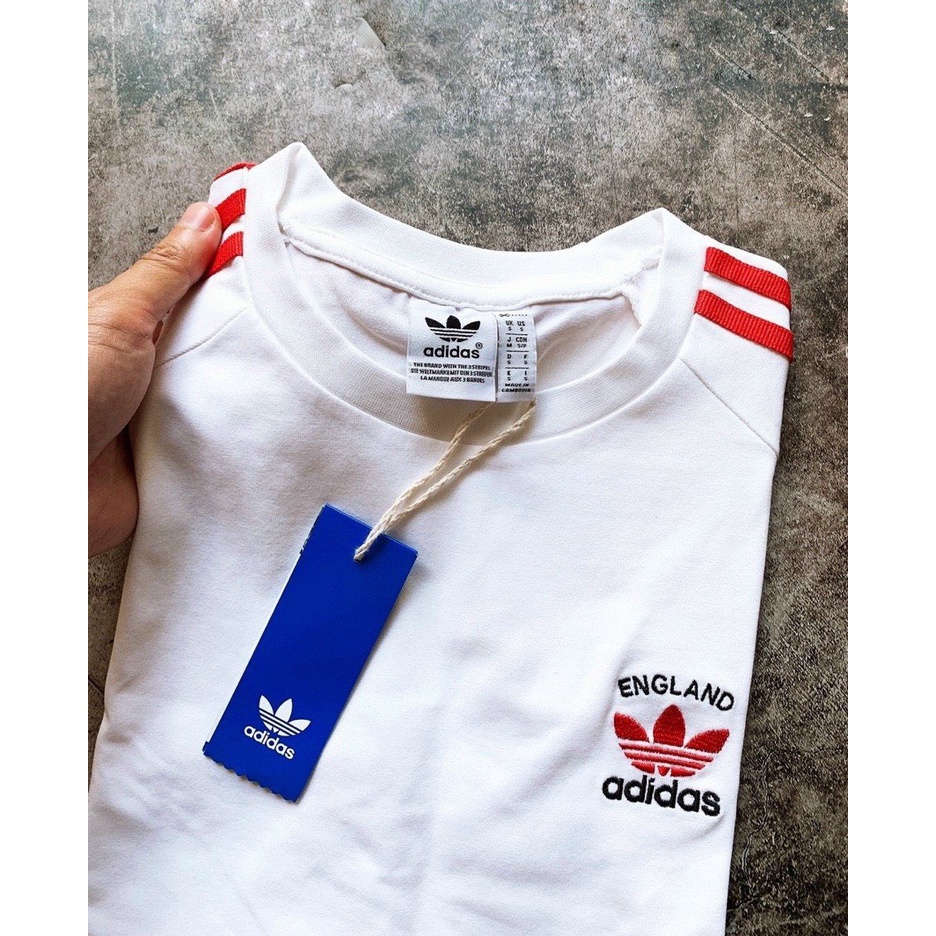 ÁO PHÔNG ADS TRẮNG SỌC ĐỎ NAM NỮ