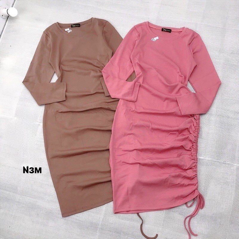 Đầm thun borip tay dài rút dây hông.