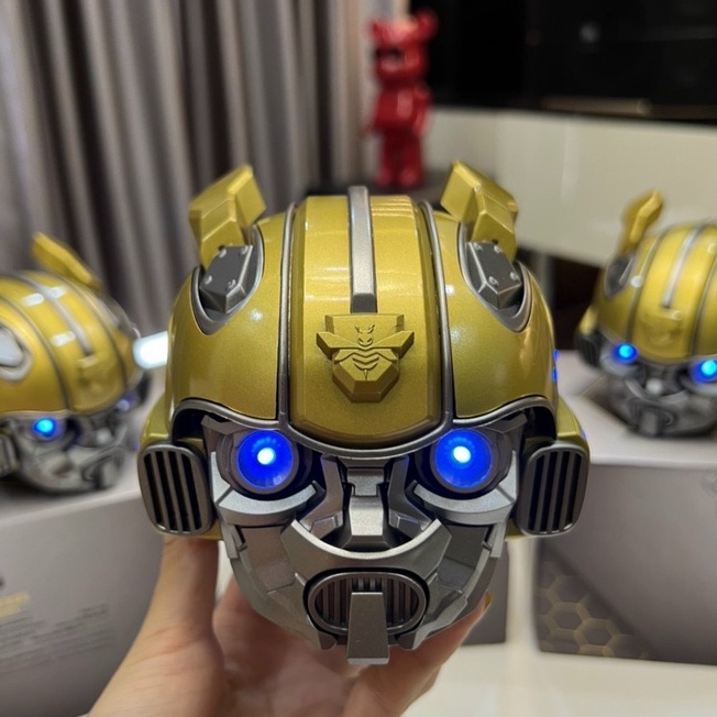 Loa Bluetooth Nghe Nhạc Siêu Bass Bumblebee Đầu Robot Mắt Có Đèn Led Xanh Âm Thanh Sống Động