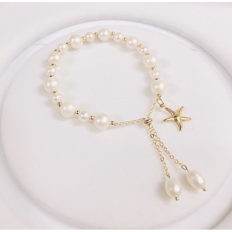 Vòng tay hạt ngọc trai nhân tạo 8ly mix charm sao biển