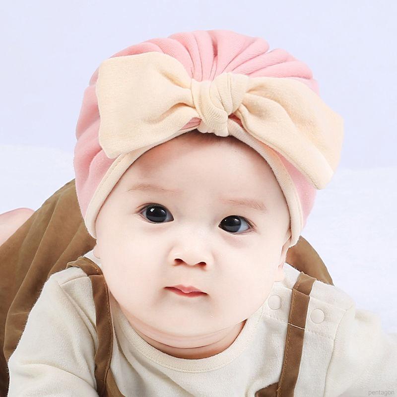 Mũ trùm đầu beanie đính nơ màu trơn đáng yêu dành cho trẻ em